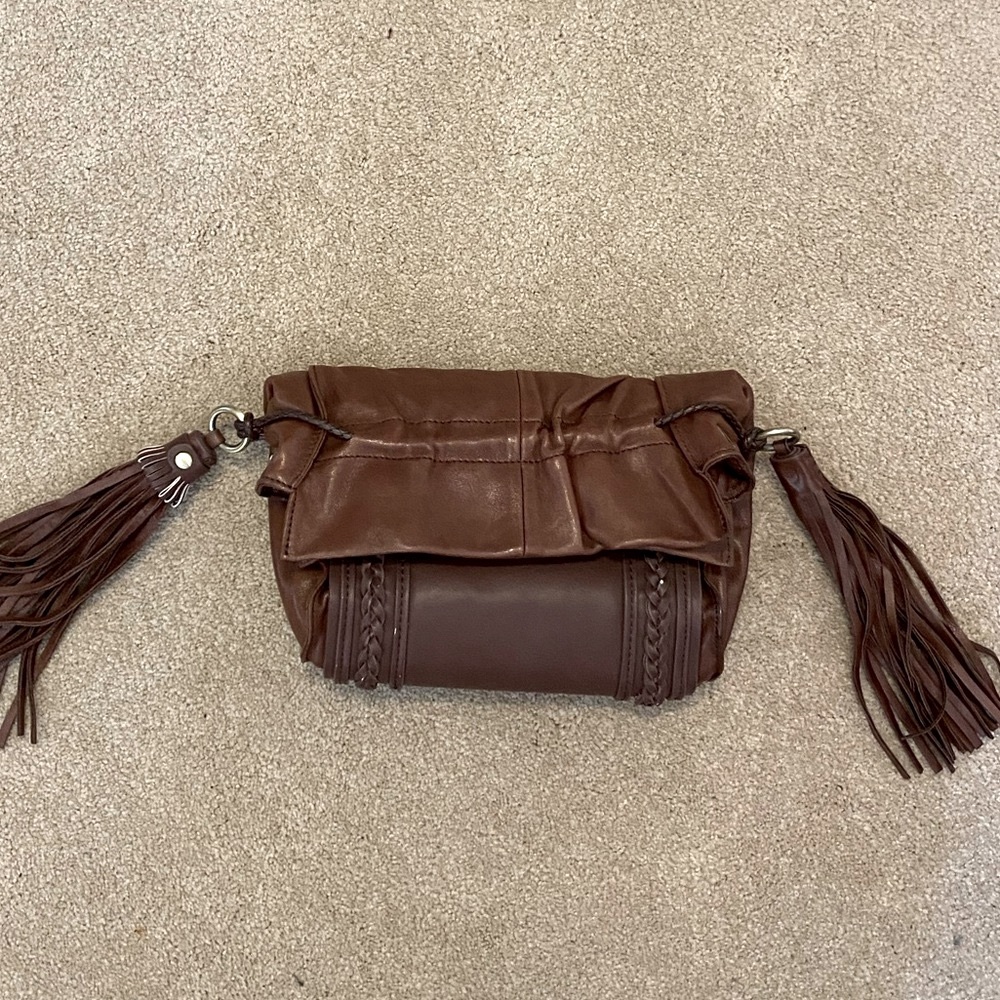 Brown leather clutch. NWT